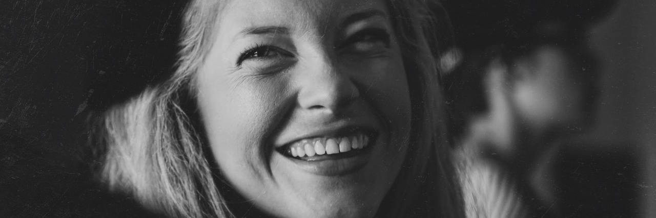 4 Lies People Believe About the Mental Health Community black and white portrait of a woman smiling