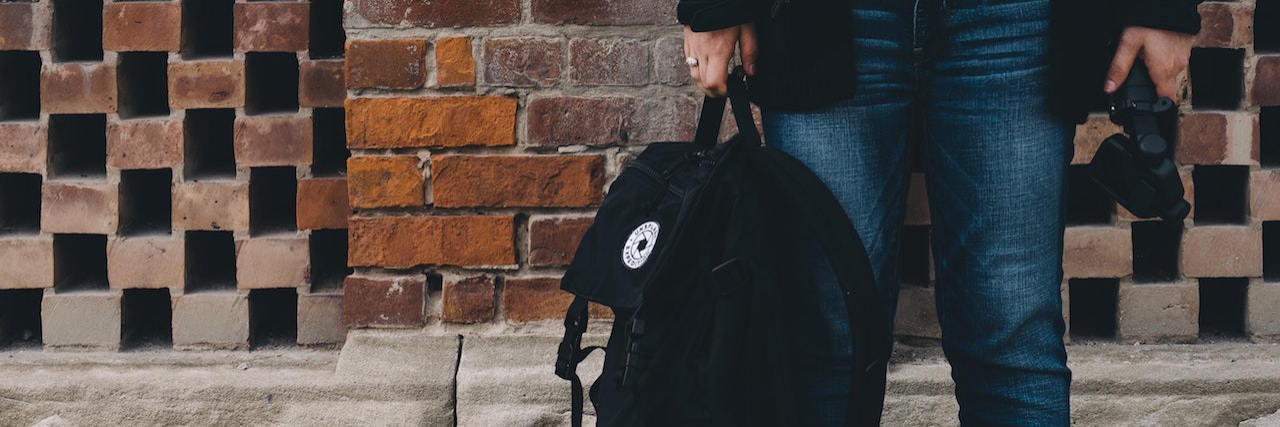 What It's Like to Have Depression and Anxiety in College A student holding a backpack