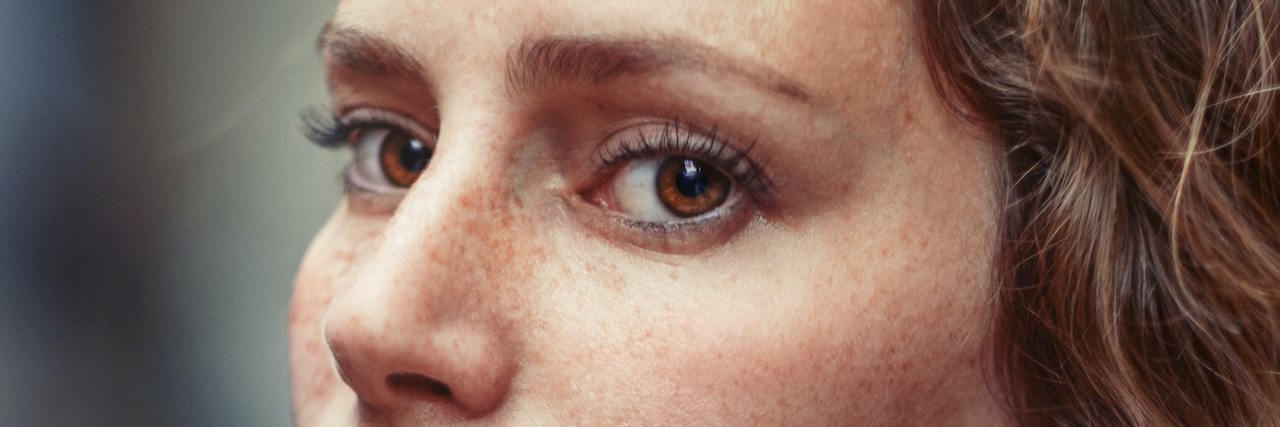 What It Feels Like to Experience 'Anticipatory Anxiety' A woman looking forward