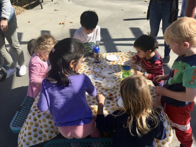 a group of small children at a picnic playdate