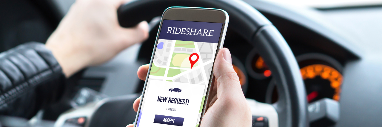 Why I Chose Self-Employment as a Person With Autism Rideshare driver in car using app.