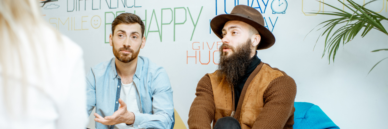 What to Know About LGBTQ-Affirming Therapists photo of a gay couple during a therapy session