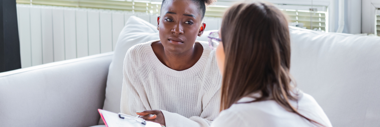 Being a Therapist While Managing Chronic Illness Therapist meeting with patient.