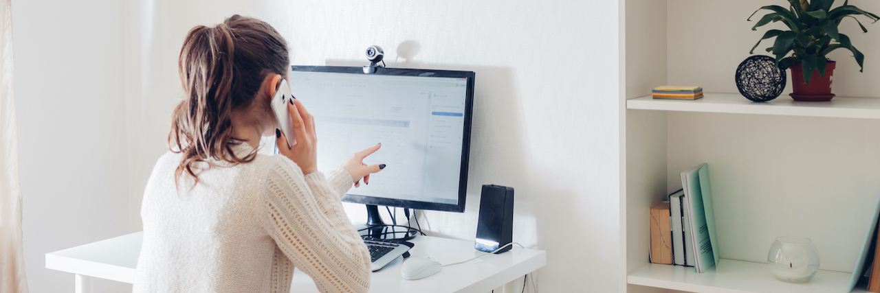 Returning to Work With Complex Regional Pain Syndrome woman sitting at her desk