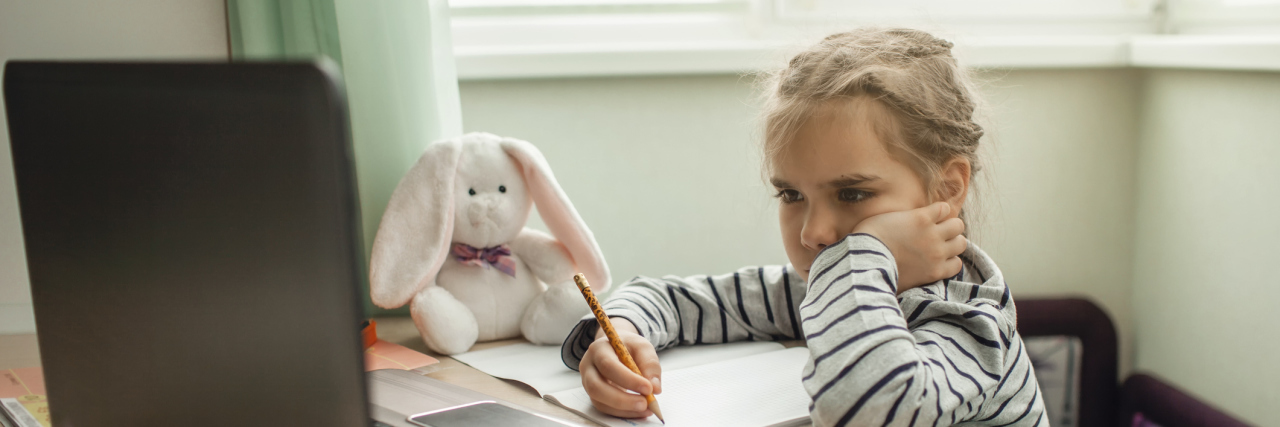 Helping Kids and Adults Cope With 'Zoom Fatigue' During COVID-19 Girl doing online school classes.