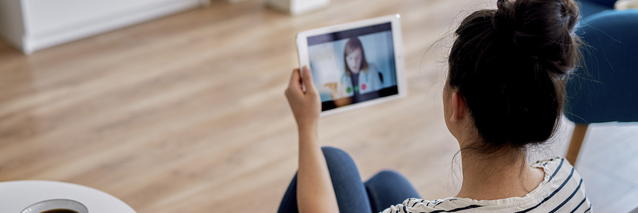 How Telemedicine Is Challenging My Eating Disorder Recovery Young woman having a telehealth session with a doctor