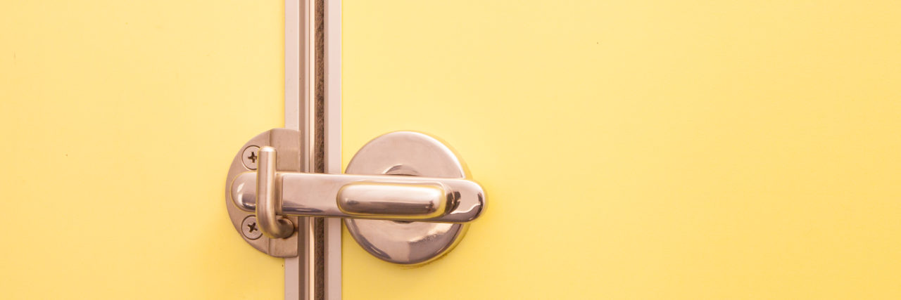 An Accident in the McDonald's Bathroom Because of Multiple Sclerosis a toilet door in locked position.