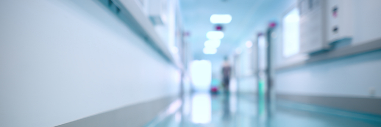 Facing the Stigma of Psychiatric Hospitalization Blurred photo of medical hospital hallway