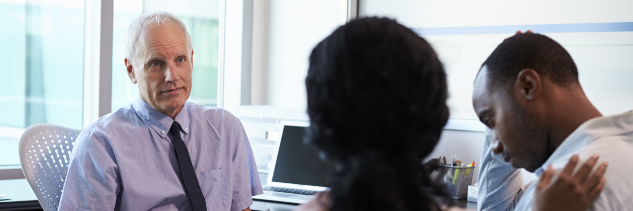 How White People Can Help Fight Systemic Racism in Health Care Doctor talking to Black couple.