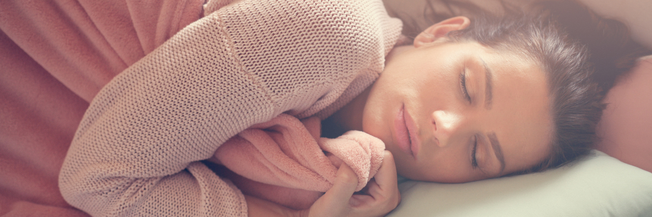 Gift Ideas for a Loved One Experiencing a Crohn's Disease Flare-Up Woman resting on the couch.