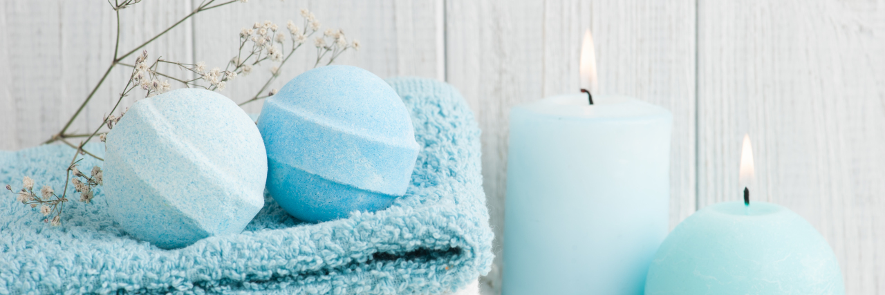 Self-care with bath bombs, candles.