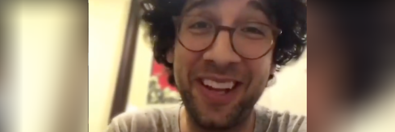 New Amazon Series 'On the Spectrum' Features Actually Autistic Actors Rick Glassman, a white man with dark, curly hair wearing glasses and a gray T-shirt