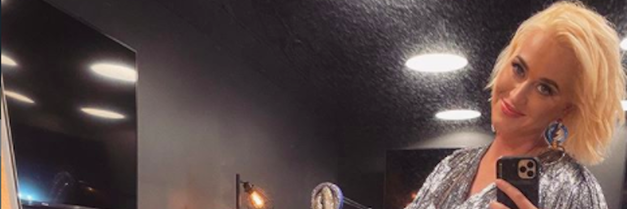 Katy Perry Experienced Suicidal Thoughts During Breakup Katy Perry takes a mirror selfie while wearing a sparkly silver outfit