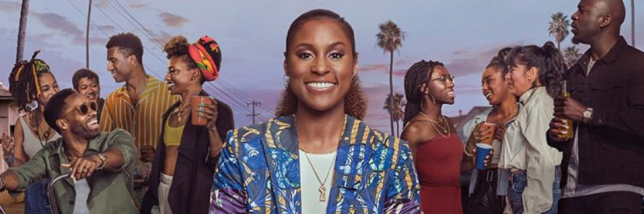 Insecure poster, Issa Rae's character smiling wide on a street in Los Angles