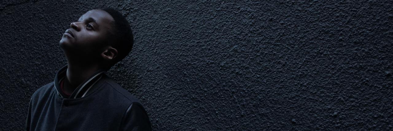 What to Know About the Upcoming 'Eight Days' Mental Health Series photo of man leaning back against wall