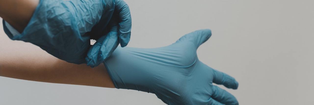 Finding a Doctor Who Listens and Knows Ehlers-Danlos Syndrome A doctor putting on gloves