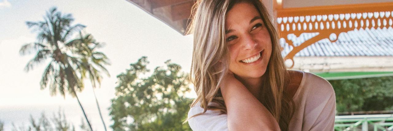 What Eating Disorder Recovery 'Gives' You photo of woman sitting on porch smiling