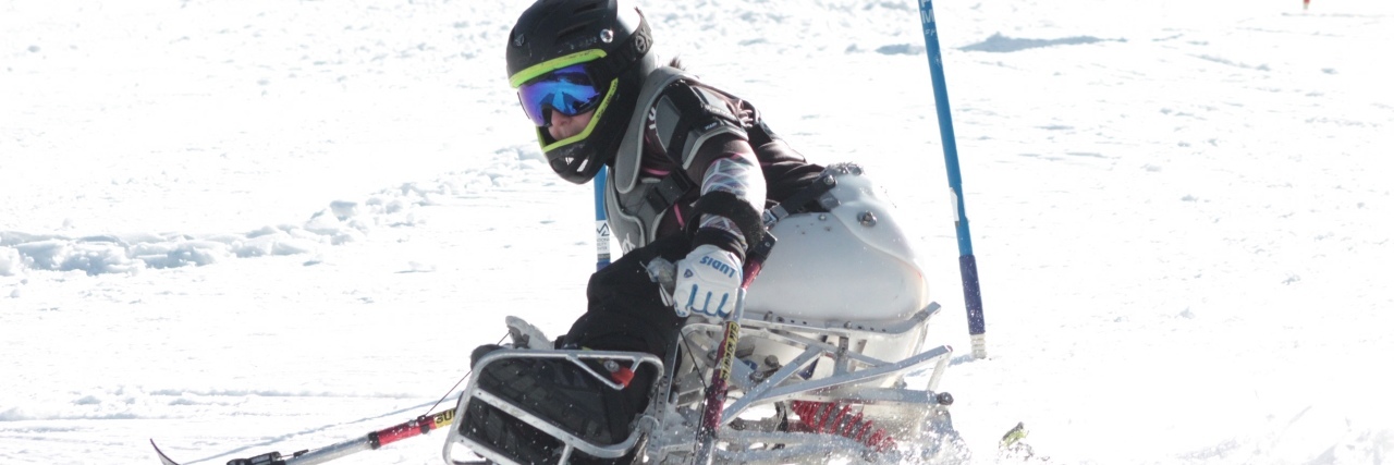 Saylor competing in adaptive skiing.