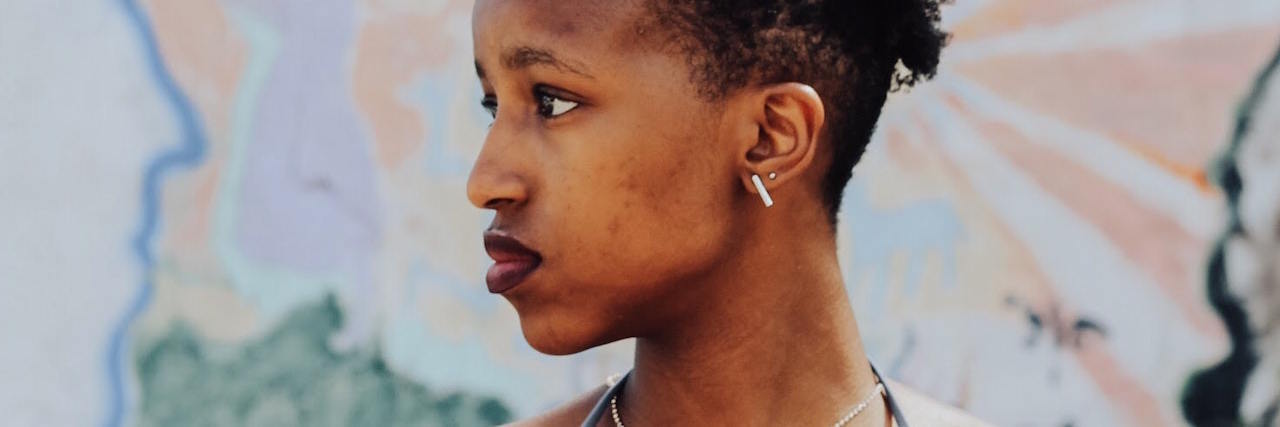 What 'Emotional Labor' Means to a Black Women A woman looking over her shoulder