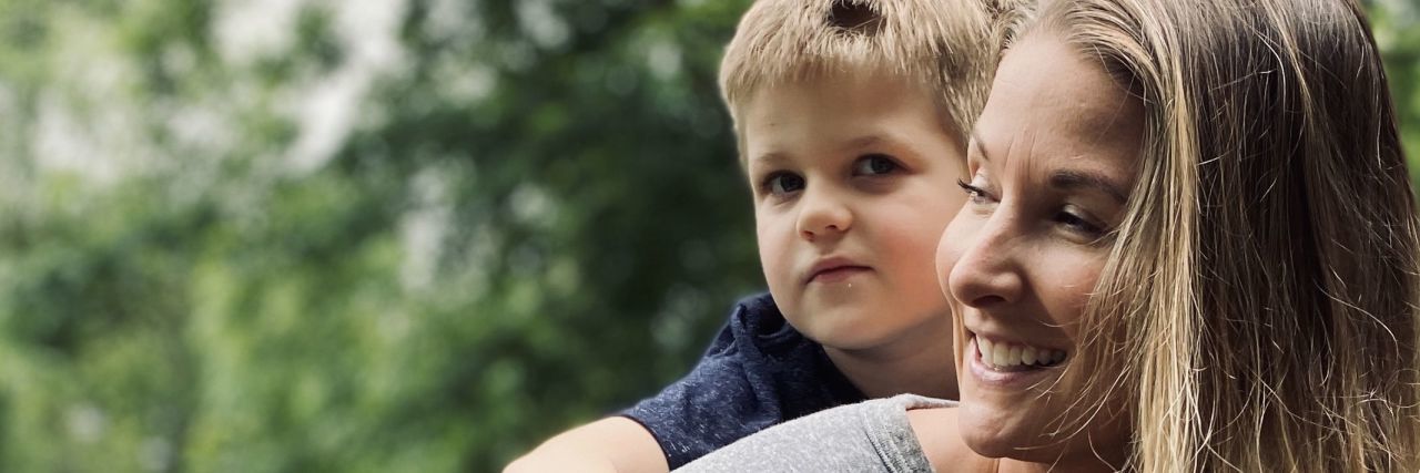 Staying Resilient Through the Challenges of Autism During COVID-19 Lauren carrying Wilson on her shoulders.