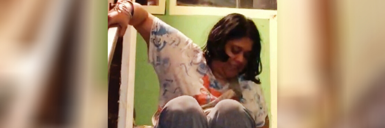 Feeling 'Unwanted' 30 Years After the Americans With Disabilities Act Priya pulling herself down stairs.