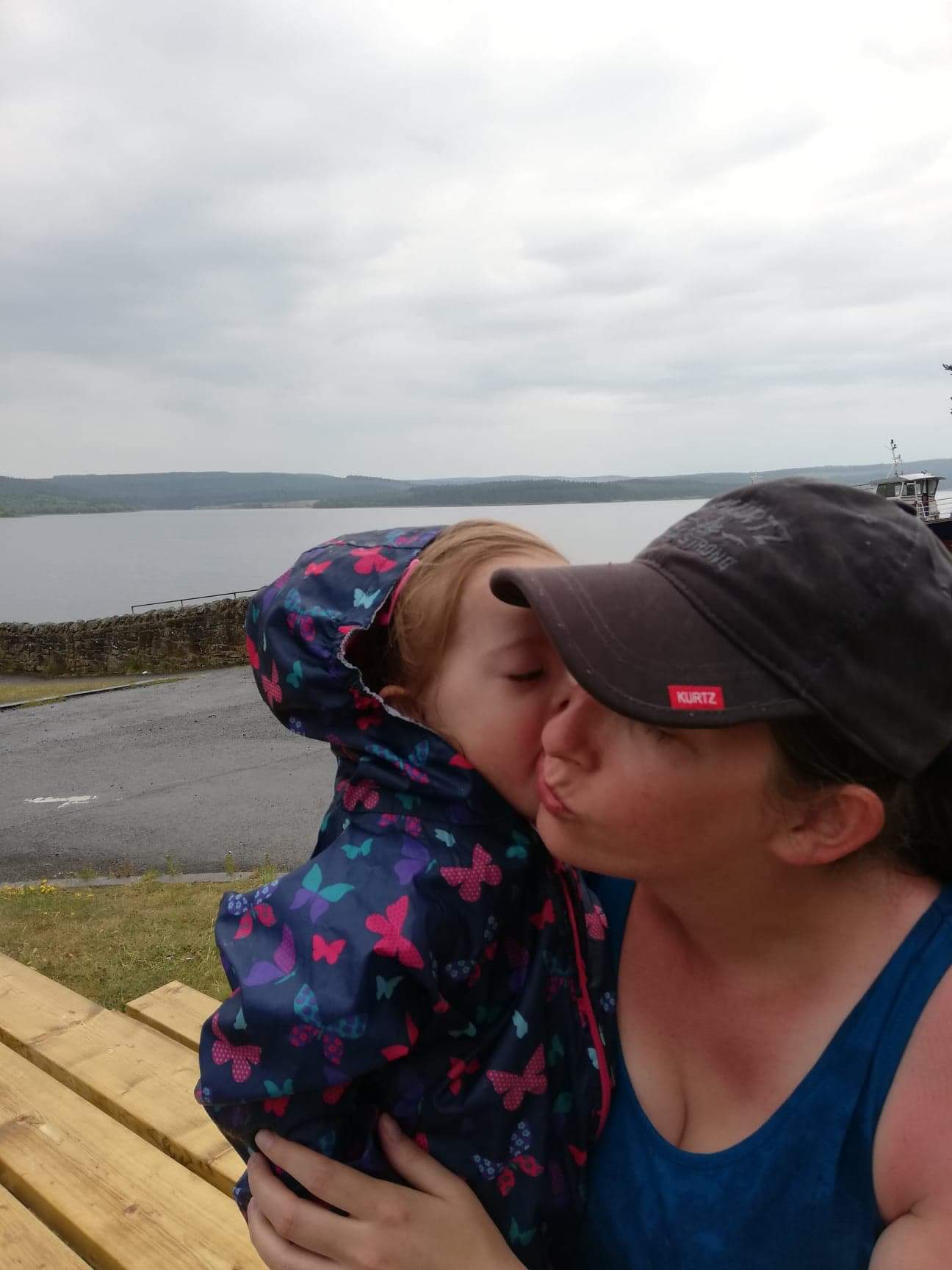 Rachel and Betsy by the water on a cloudy day.