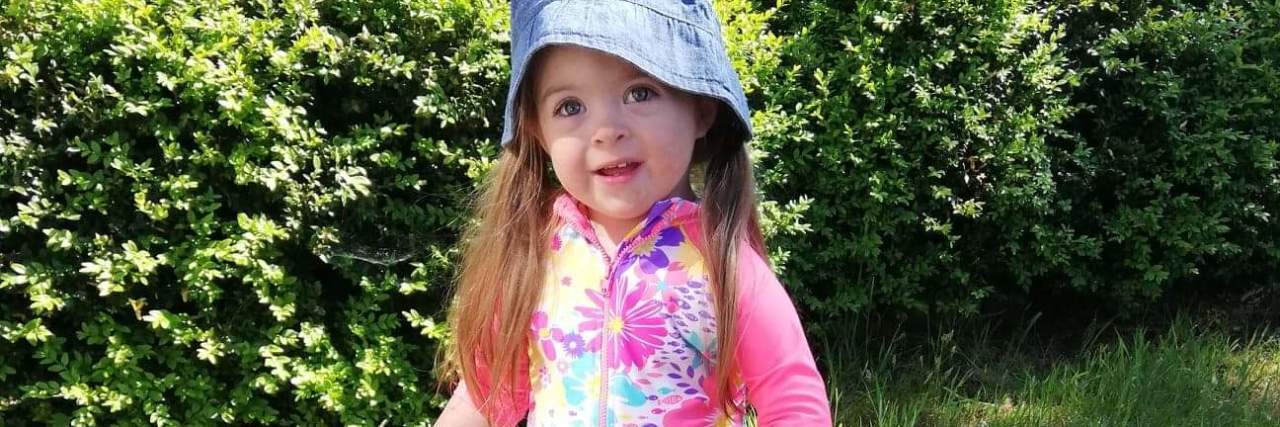 Bias Against People With Down Syndrome in the NHS Betsy playing in the garden.