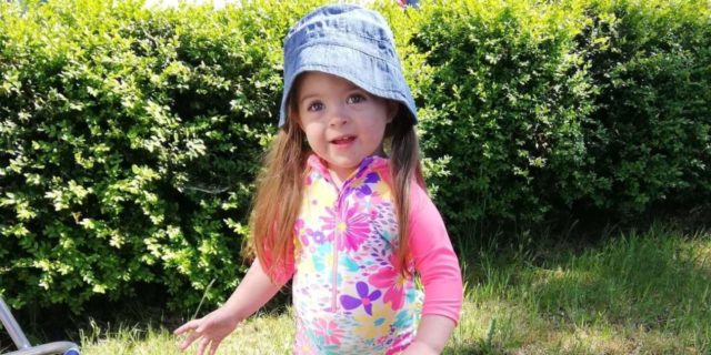 We Need to Talk About Bias Against People With Down Syndrome in the NHS Betsy playing in the garden.