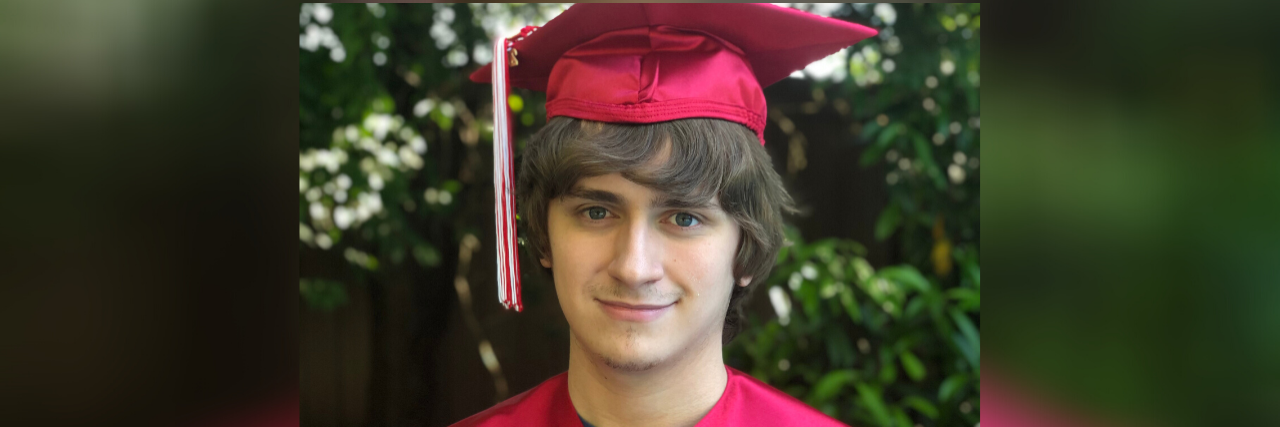 A Letter to My Son With Autism on His Graduation Day Ryan wearing his cap and gown.