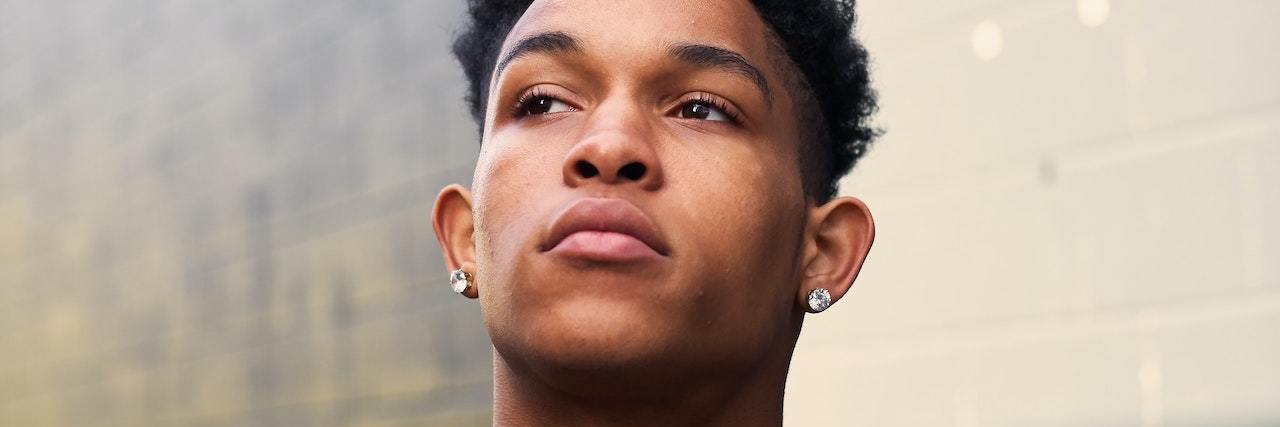 America Is Dangerous for Black People With Mental Illness Young black man wearing a black zipper jacket and black T-shirt