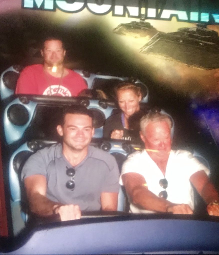 photo of the contributor and family on Space Mountain at DIsneyland