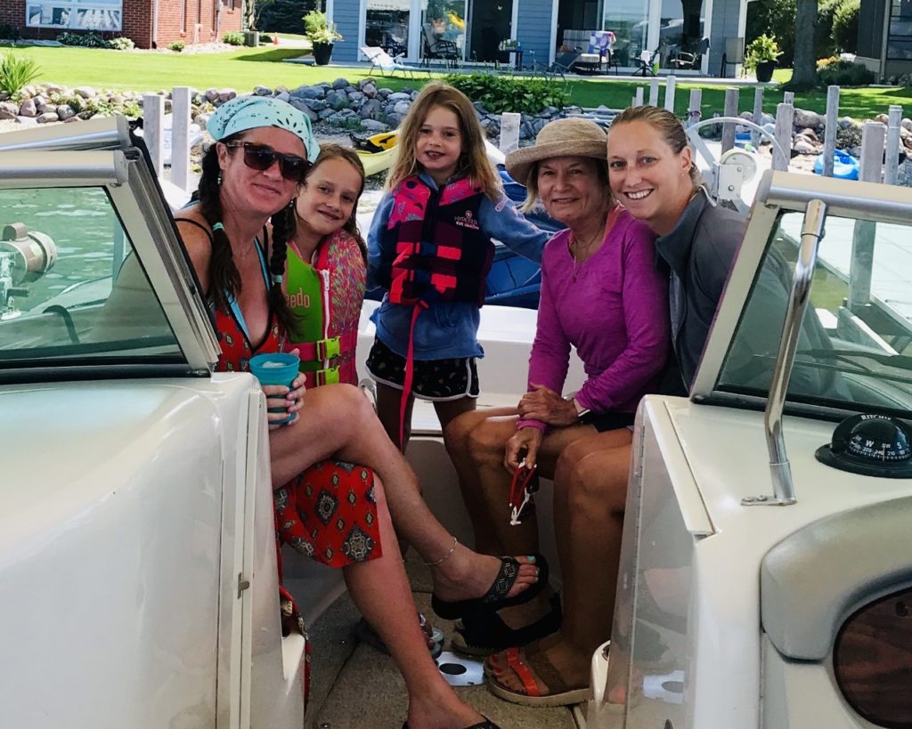 photo of the contributor and family on a lake boat