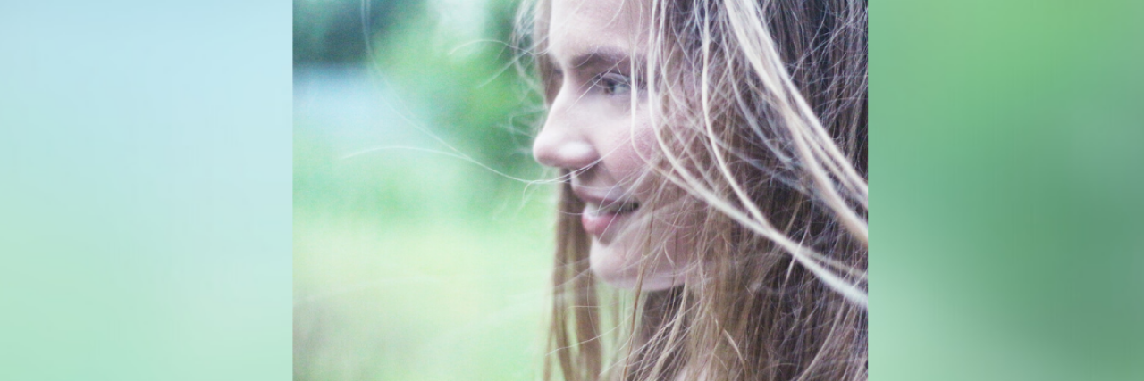 What It's Like to Receive a Cancer Diagnosis at 24 Young woman in nature