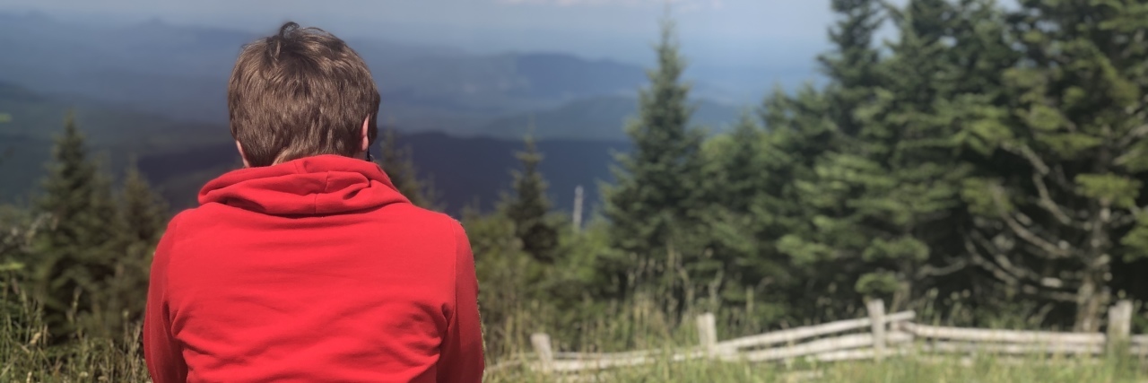 Life Lessons My Autistic Son Taught Me Kathy's son looking toward a valley.