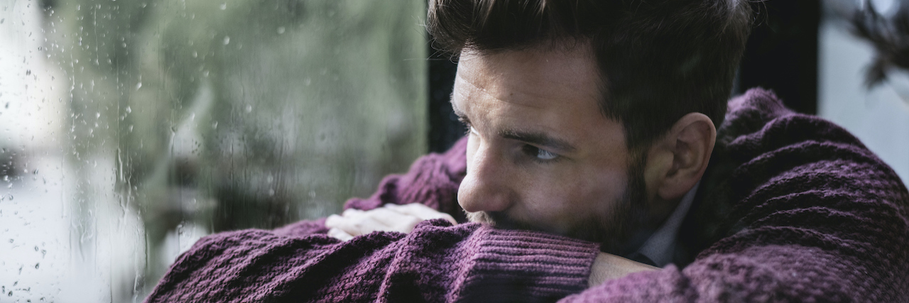 PTSD and Depression: Subconscious Thoughts vs Conscious Thoughts Man looking out the window