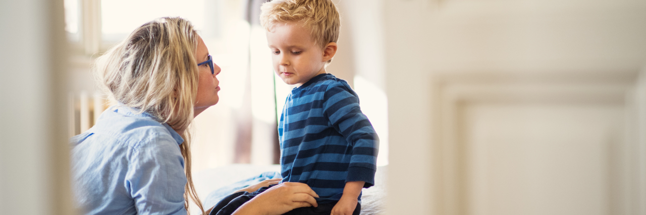 How I'm Teaching My Child About Racism While Educating Myself Mother talking to her son.