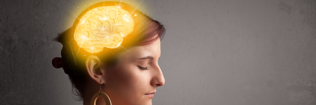 Woman thinking with glowing brain illustration.