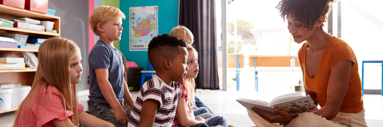 Why My Mental Health Challenges Make Me a Better Teacher Teacher reading to students.