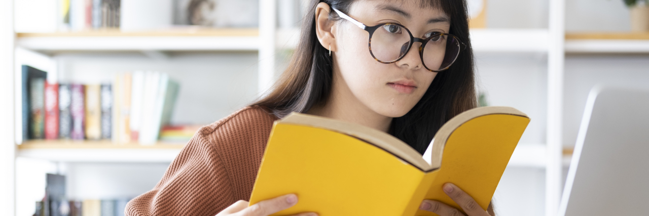 How Reopening Schools During COVID-19 Harms Students With Disabilities Young woman studying online.