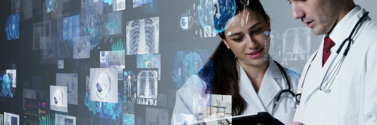 We Need More Research Studies About Adults With Cerebral Palsy Medical researchers looking at data on tablet.