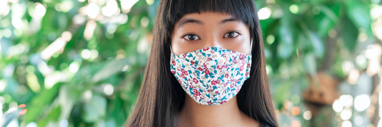 COVID-19 Fears Dismissed By Medical Professional A woman wearing a mask