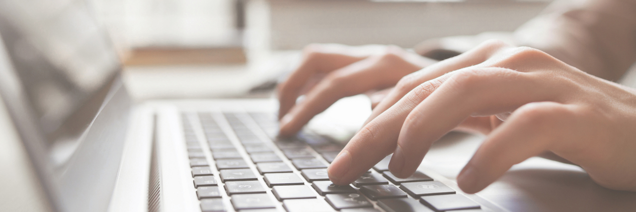 What COVID-19 Teaches Us About the ADA and the Future of Accessibility Woman using laptop at home.