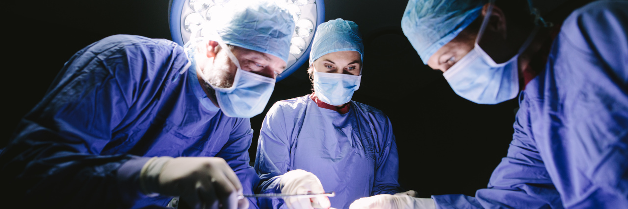 Coping With Frequent Surgeries Because of Ehlers-Danlos Syndrome Medical team performing operation in hospital