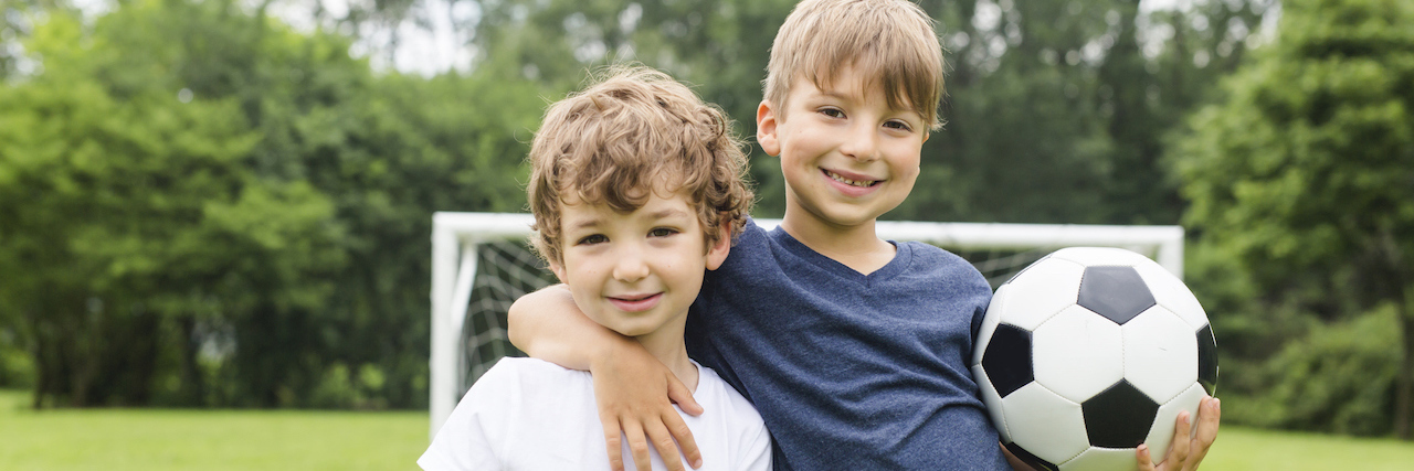 What Is Was Like Getting a PFIC Liver Disease Diagnosis for My Sons Two little brothers having fun playing with ball