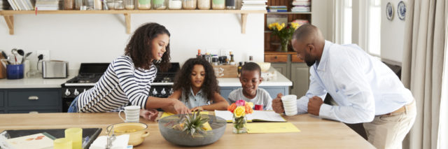 A Black family at the kitchen table