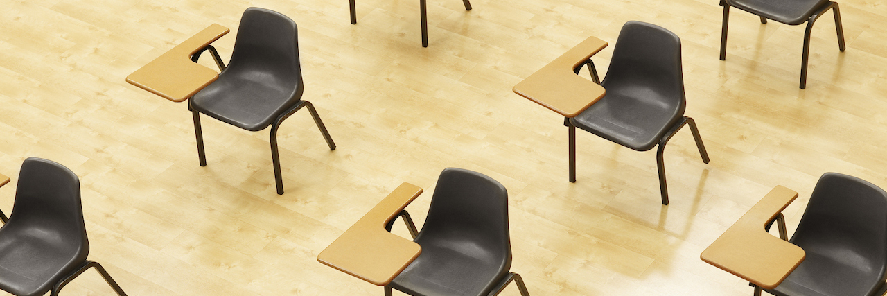 Desks in empty classroom