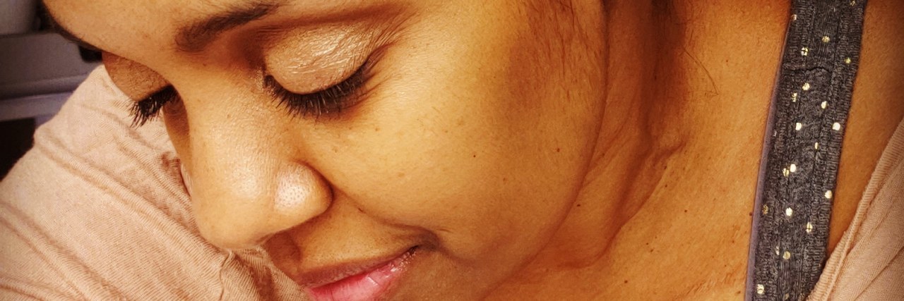 Being Neglected and Judged in the ER as a Sickle Cell Disease Patient Marissa, a Black woman wearing a gray head scarf.