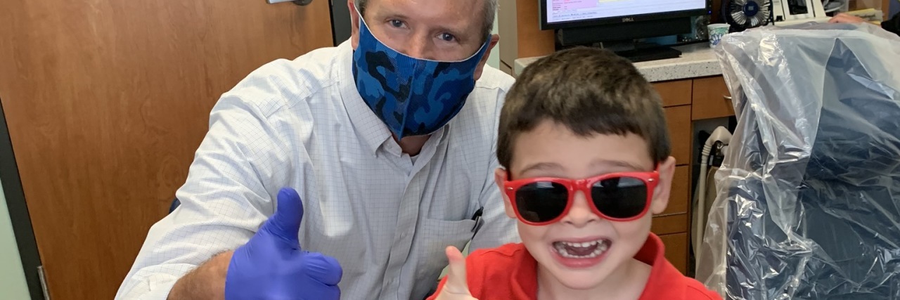 Tips for Helping Children With Autism Cope With Dental Visits Amy's son at the dentist.