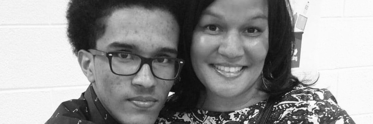 Matthew Rushin: an Autistic Black Man Arrested After Car Accident A black and white photo of Matthew Rushin with his arms around his mom, Lavern