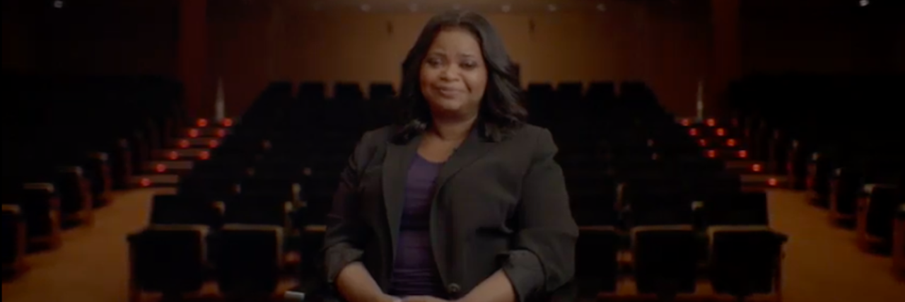 Octavia Spencer Gets Why Authentic Disability Representation Matters Octavia Spencer sits in a chair in front of empty rows of theater seats